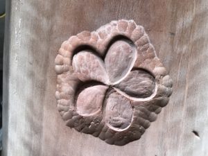 The flower carved into the back